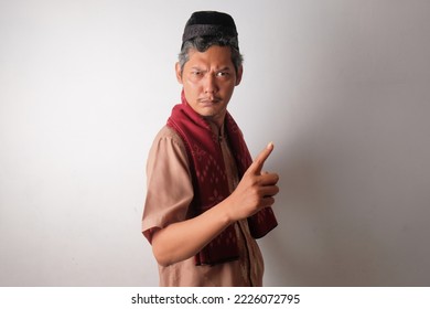 funny indonesian muslim man taking a stance - Shutterstock ID 2226072795