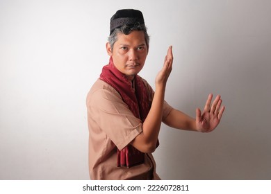 funny indonesian muslim man taking a stance - Shutterstock ID 2226072811