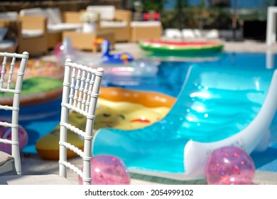 Funny Inflatable Unicorn Ring Floating In Swimming Pool On Sunny Day. Swimming Pool Party Concept.No People.