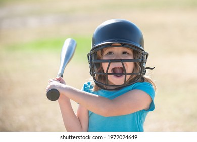 Funny Kid Up To Bat At A Baseball Game. Close Up Portrait.