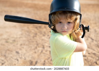 Funny Kid Up To Bat At A Baseball Game. Close Up Child Portrait.