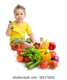 Funny Kid Boy Eating Vegetables. Healthy Food Concept.