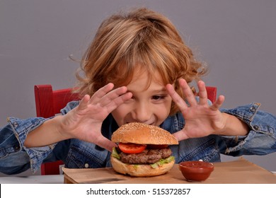 Funny Kid Portrait Eating Burger.