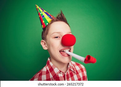 Funny Kid With Red Nose Having Fun On Birthday Party