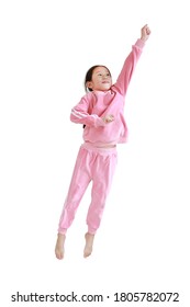 Funny Little Asian Child Girl In Pink Tracksuit Or Sport Cloth Jumping On Air Over White Background. Freedom Kid Movement Concept.