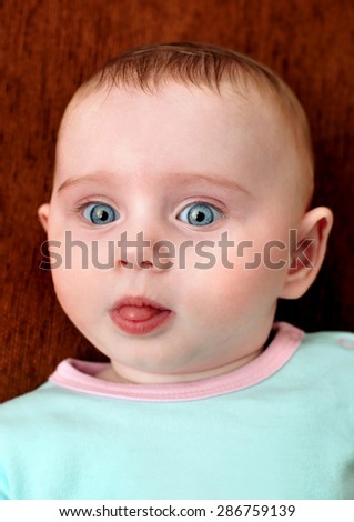 Similar – Little baby girl with funny surprise expression on her face