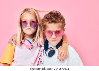 funny little boy and girl in sunglasses have fun with friends casual kids fashion