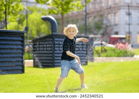 Similar – Adorable little girl playing with a ball sitting on a park bench