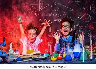 Funny little children doing experiments in the laboratory. Explosion in the laboratory. Science and education.