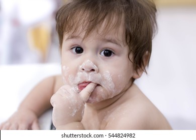 Funny Little Dirty In Flour Helping Her Mom In The Kitchen, Than To Take A Child In One Of The Games Kitchen