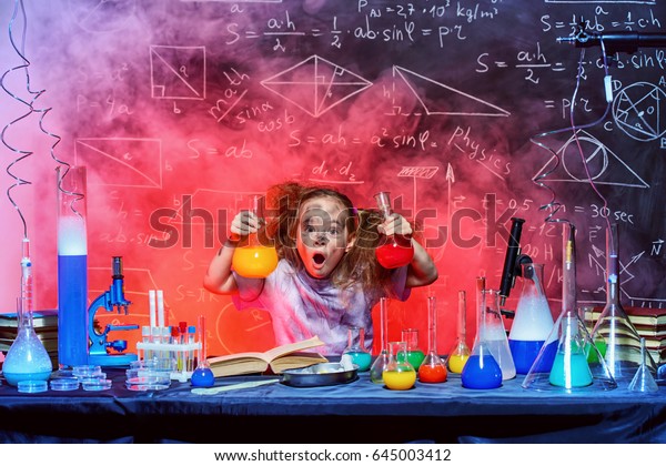 funny-little-girl-doing-experiments-600w