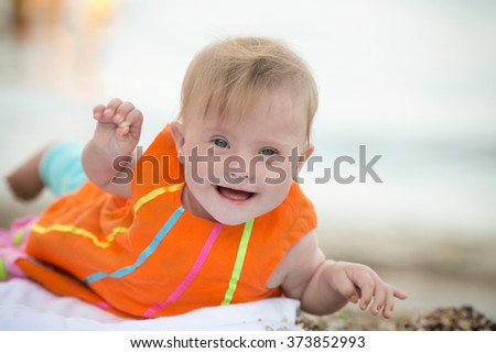 funny little girl with Down's syndrome