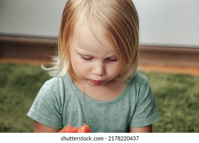 Funny Little Girl Eating Watermelon Close-up. Cute Child With Watermelon Indoors. Concept Of Healthy Food, Summertime. Copy Space