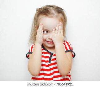 Funny little girl that cheats in hide and seek game