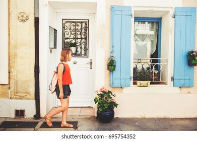 Funny Little Girl Traveler Walking On The Streets Of Provence, Wearing Backpack. Travel With Kids, Family Vacation On South Of France, Image Taken In Aigues-Mortes, Camargue