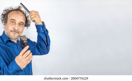 Funny Looking Man With Bad Hair Day Facing Decision Comb Or Cut With Hair Trimmer. Copy Space To The Right