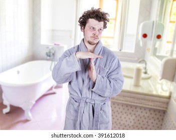 Funny Man With Bathrobe In Bathroom
