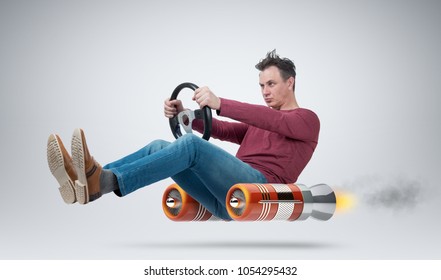 Funny man car driver with a wheel, concept of alternative transport