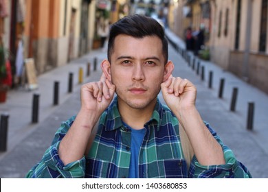 Funny Man Doing A Hearing Test Outdoors 