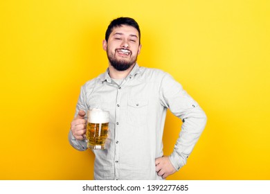 Funny Man With A Glass Of Beer And Foam On His Mustache And Nose Over Yellow Background, Party Concept