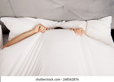 Funny Man Hiding In Bed Under The Sheets.