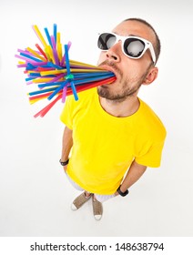 funny man with juice straws in his mouth wearing sun glasses and yellow t shirt