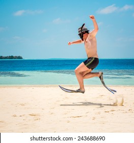Funny Man Jumping In Flippers And Mask. Holiday Vacation On A Tropical Beach At Maldives Islands.