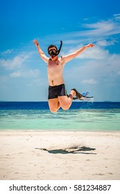 Funny Man Jumping In Flippers And Mask. Holiday Vacation On A Tropical Beach At Maldives Islands.