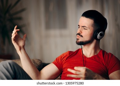 Funny Man Listening To Music Doing Air Guitar Gesture. Happy Guy Rocking Single Bachelor Life Having Fun
