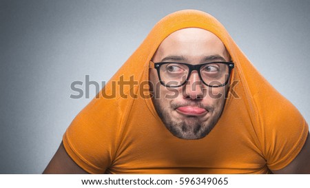 Funny man looking to side, isolated on gray background. Closeup, studio shot 