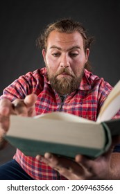 Funny Man Reading Book, Very Interested In Subject