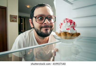 Funny Man Sees The Sweet Cake In The Fridge