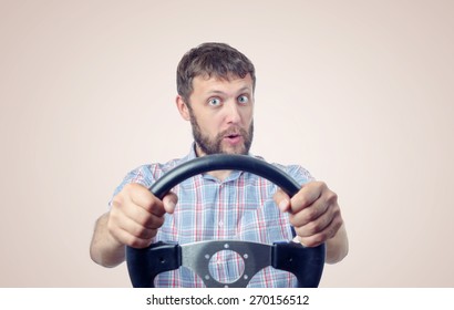Funny man with a steering wheel, car drive concept