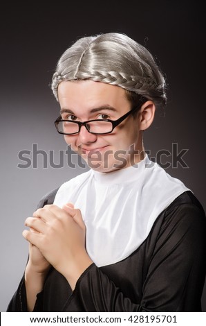 Funny man wearing nun clothing