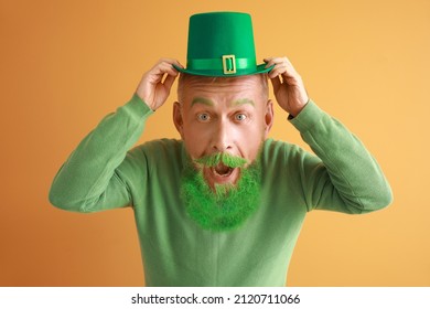 Funny Mature Man With Big Head And Green Hat On Color Background. St. Patrick's Day Celebration