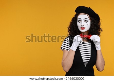 Funny mine with beret posing on orange background, space for text