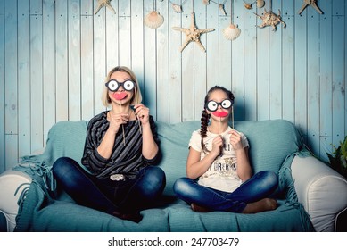 Funny Mom And Daughter With False Mustaches, Playing At Home