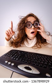 Funny nerd girl working on computer - Shutterstock ID 1367898929