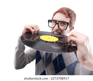 Funny nerd guy with big glasses, he is holding a vinyl record and biting it