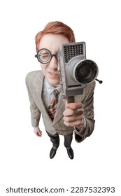 Funny nerd guy holding a vintage video camera and shooting a video - Shutterstock ID 2287532393