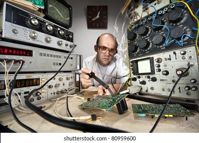 Funny Nerd Scientist Soldering At Vintage Technological Laboratory