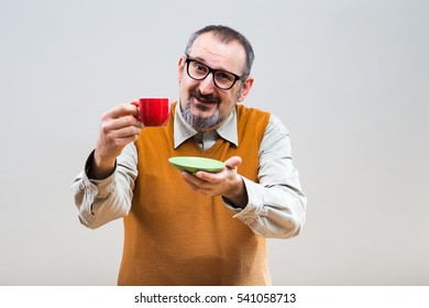 Funny nerdy man enjoys drinking coffee.Nerdy man drinking coffee
 - Powered by Shutterstock