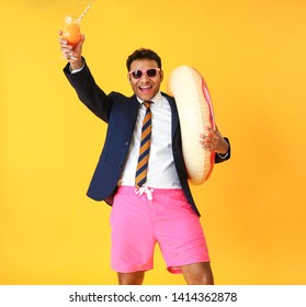 Funny Office Worker With Cocktail And Swimming Ring Dreaming About Vacation On Color Background