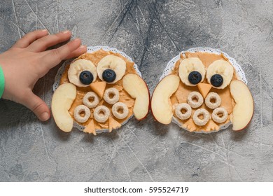 Funny Owl With Peanut Butter, Cereal And Fruits Banana Apple On Rice Cake For Kids Breakfast