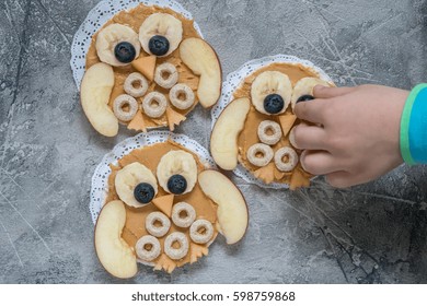 Funny Owl With Peanut Butter, Cereal And Fruits Banana Apple On Rice Cake For Kids Breakfast