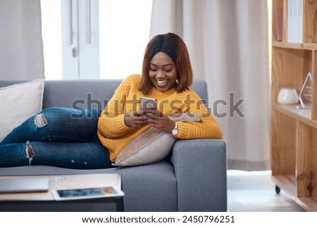 Funny, phone and black woman laughing on sofa with silly chat, text or gif communication at home. Smartphone, joke and girl reading joke, meme or app streaming social media, comic or reel in house