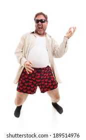 Funny Photo Of A Middle Aged Man Playing Air Guitar In His Underwear.  Full Body Isolated On White.  