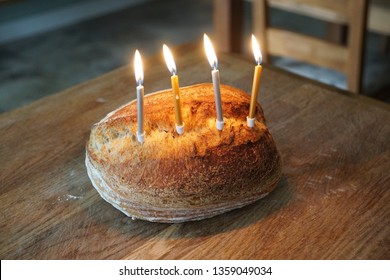 Funny Picture Of Artisanal Sourdough Golden Baked Crusty Bread With Birthday Candles On A Wooden Board