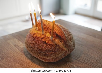 Funny Picture Of Artisanal Sourdough Golden Baked Crusty Bread With Birthday Candles On A Wooden Board