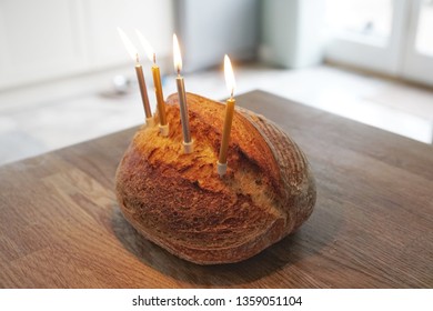 Funny Picture Of Artisanal Sourdough Golden Baked Crusty Bread With Birthday Candles On A Wooden Board